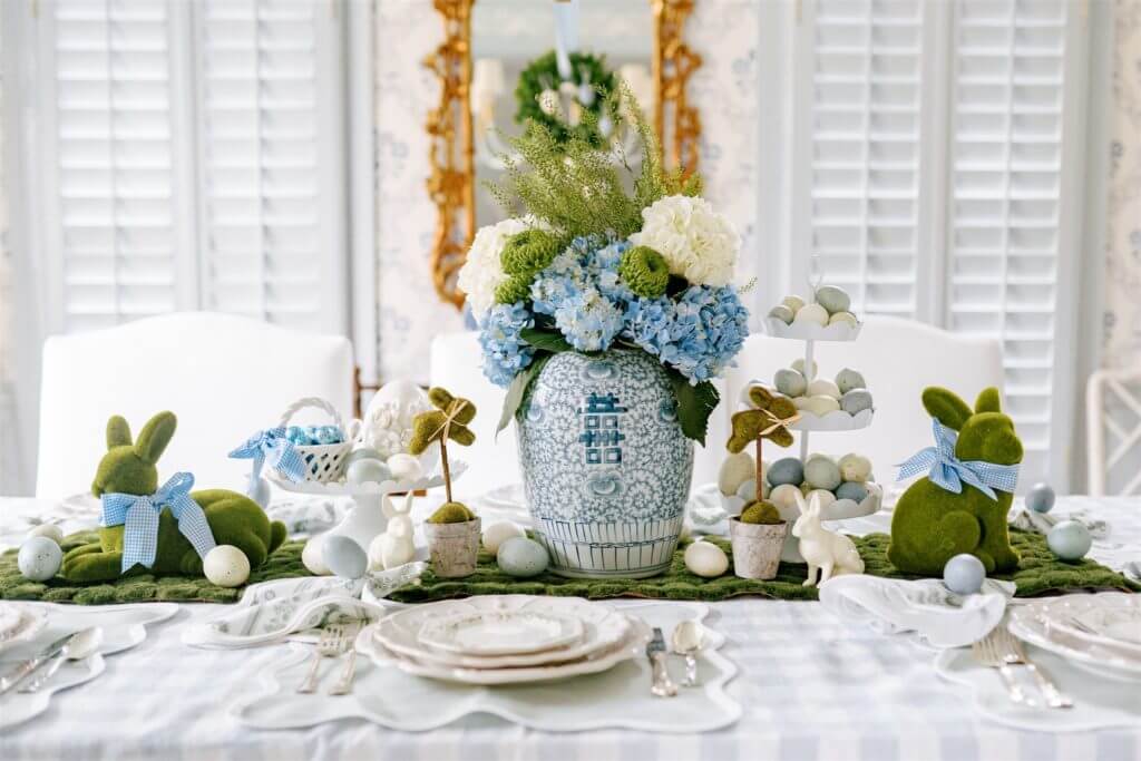 easter table decor with dyed eggs and topiary.