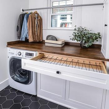 laundry room with hidden laundry room storage 