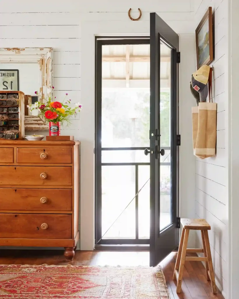 rustic entryway with dresser for storage and a tray