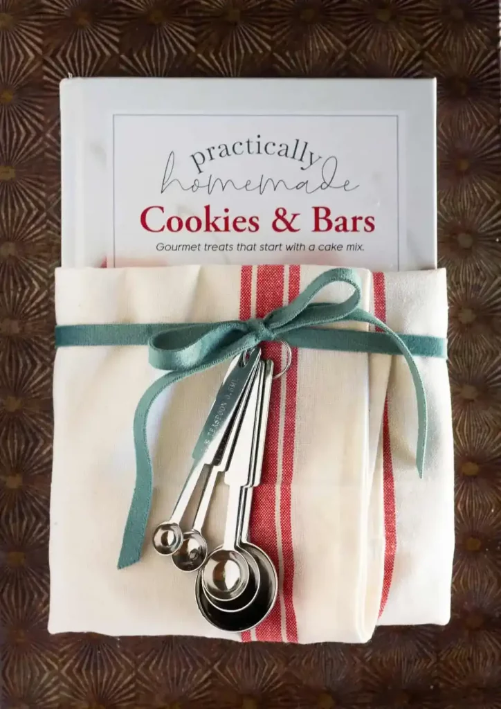 useful and cute housewarming present, cookbook and measuring sspoons