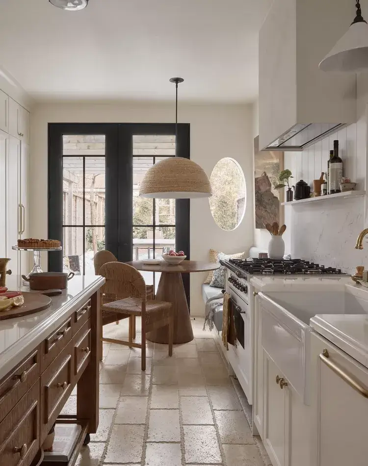 Neutral breakfast corner in gallery style kitchen.