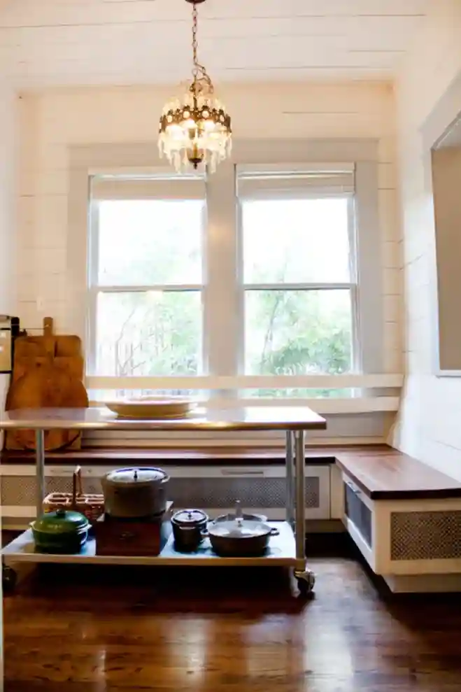 A prep table on wheels used as the table in a breakfast corner.