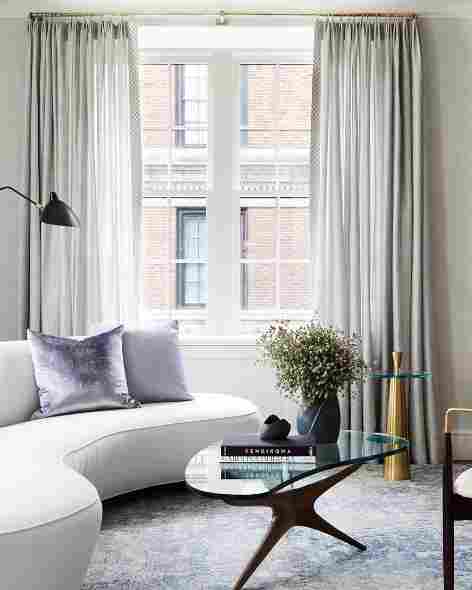 Modern minimalist homey apartment with soft textures and neutral colors demonstrating interior design for small spaces.
