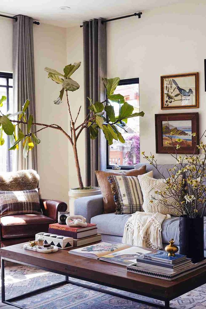 Living room with comfortable furniture and western decor items.