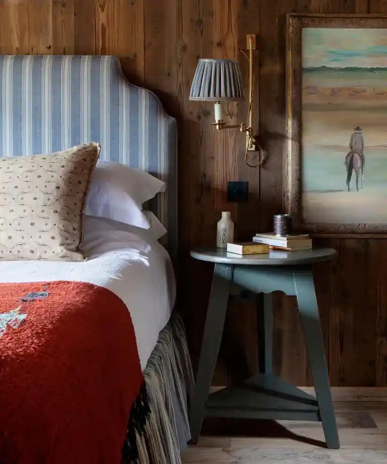 Cowboy and south west art on bedroom wall.