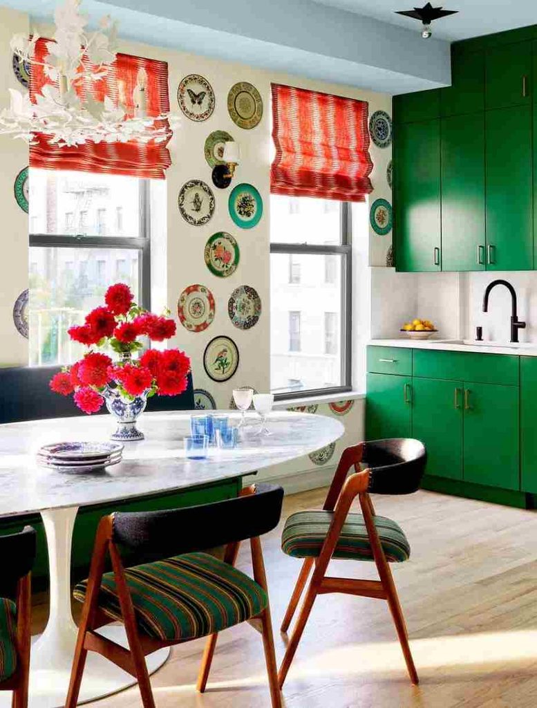 Homey apartment decorating with vintage wall plates creating personalized wall decor using family heirlooms and vintage interior design.
