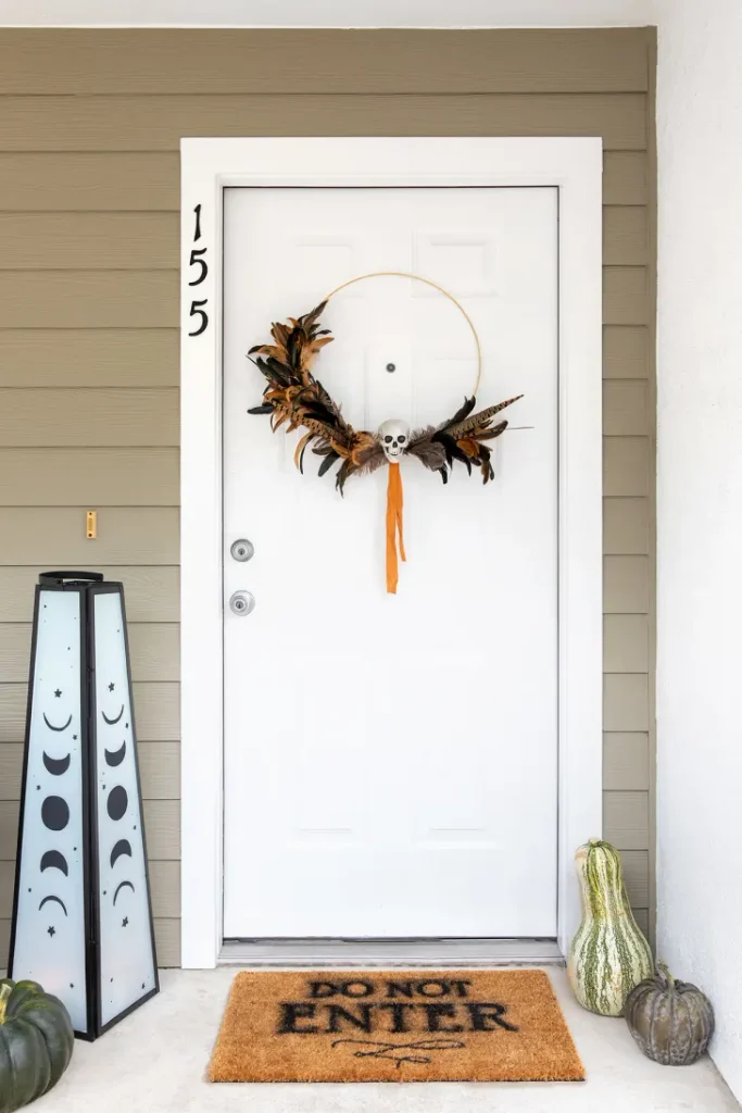 Simple Halloween decor and wreath for an apartment front door.