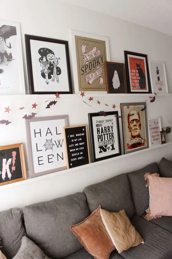 Halloween gallery wall in small apartment living room.