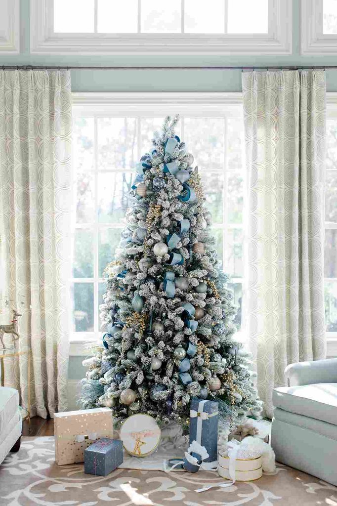 Icy blue Christmas tree decorations with silver and cream ornaments