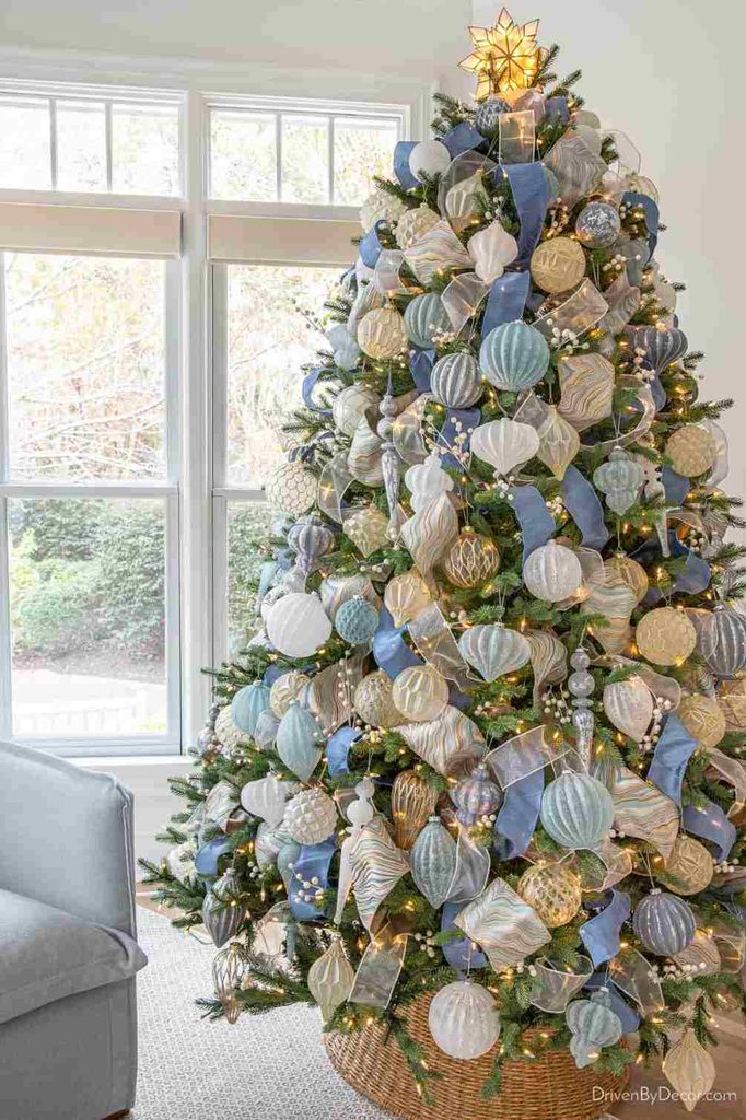 Ice blue Christmas tree ornaments with warm white Christmas lights