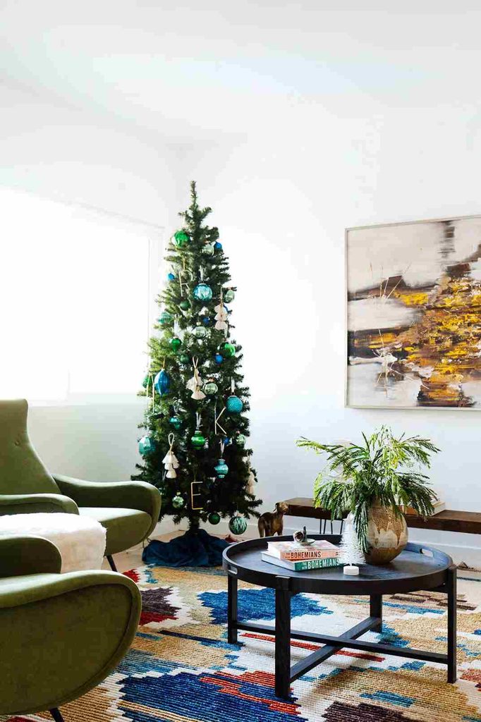 Minimalist Christmas tree decorated with simple blue ornaments in different shades