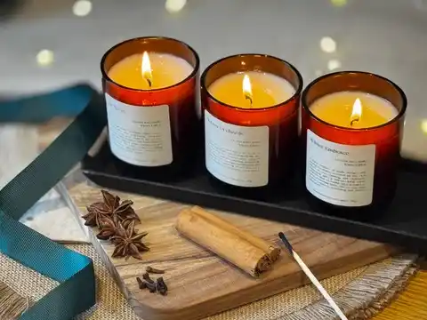 an arrangement of candles for layered fall and thanksgiving scents